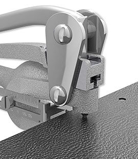 Hole punch punching a hole